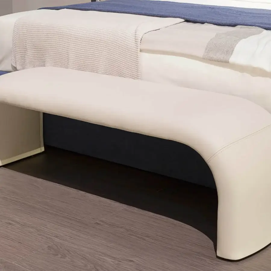 Distinguished Turri Eclipse bench with bridge-shaped structure upholstered in cream material and gold metal accent