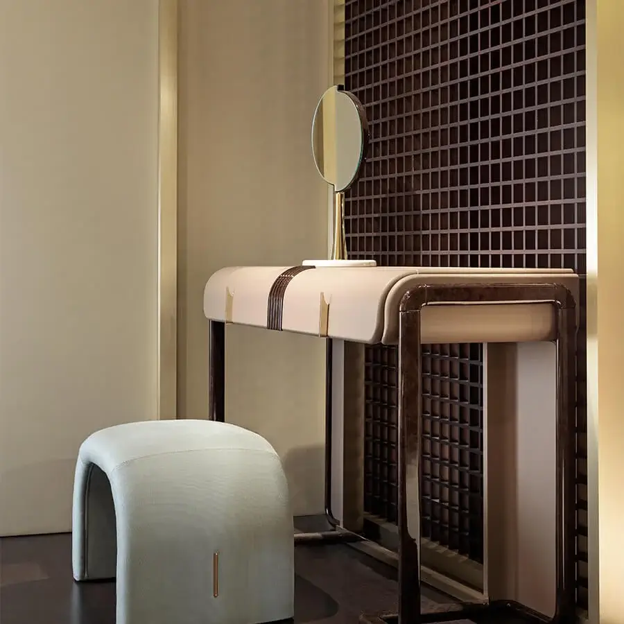 Distinguished Turri Eclipse ottoman with light grey fabric upholstery and gilded metal detail