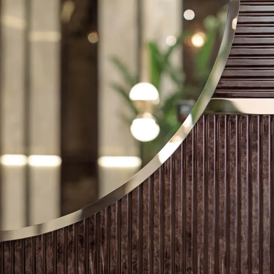 Superior Turri Eclipse mirror with glossy lacquered dark brown wood and light gold metal accents