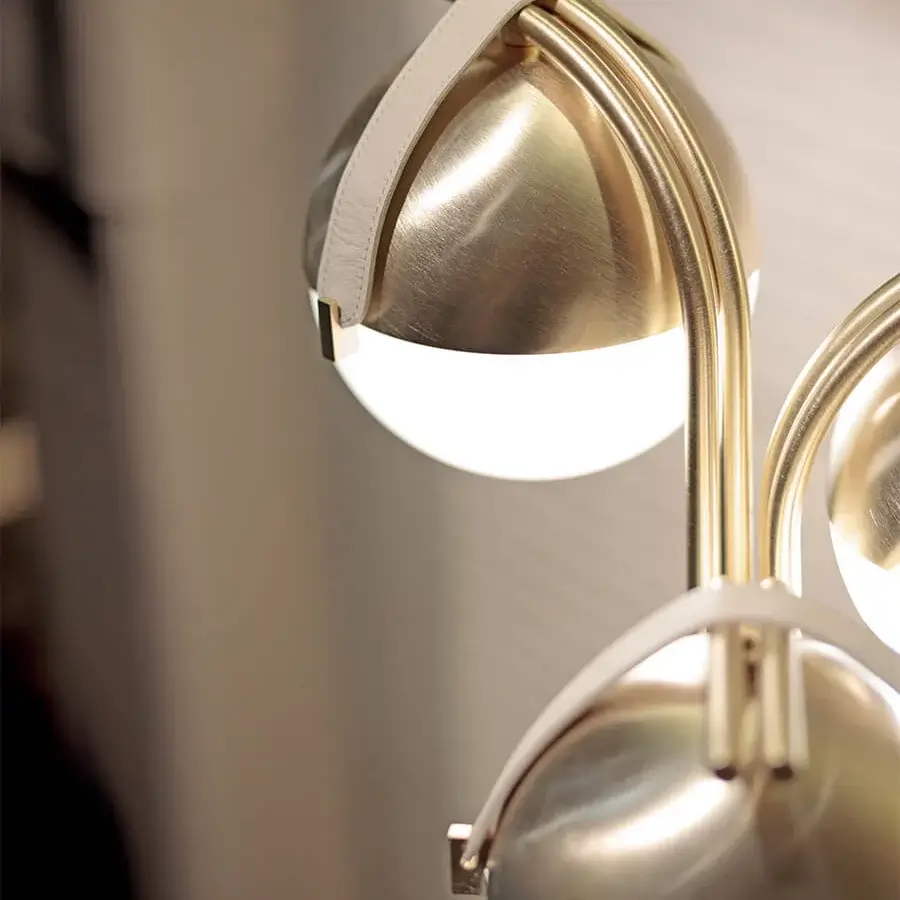 Exceptional Turri Eclipse floor lamp with opaque white glass spheres suspended by light-colored leather straps and glossy satin metal arms