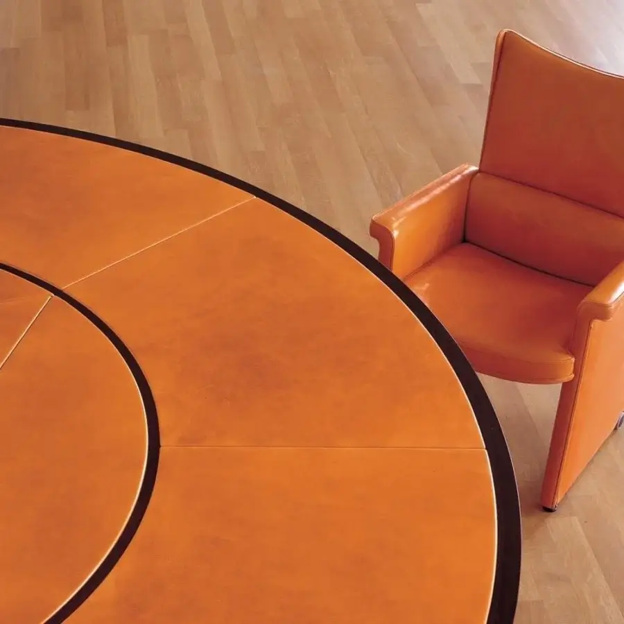 Distinguished Mascheroni Planet conference table crafted in Italy with an orange synthetic surface and dark brown circular inlays