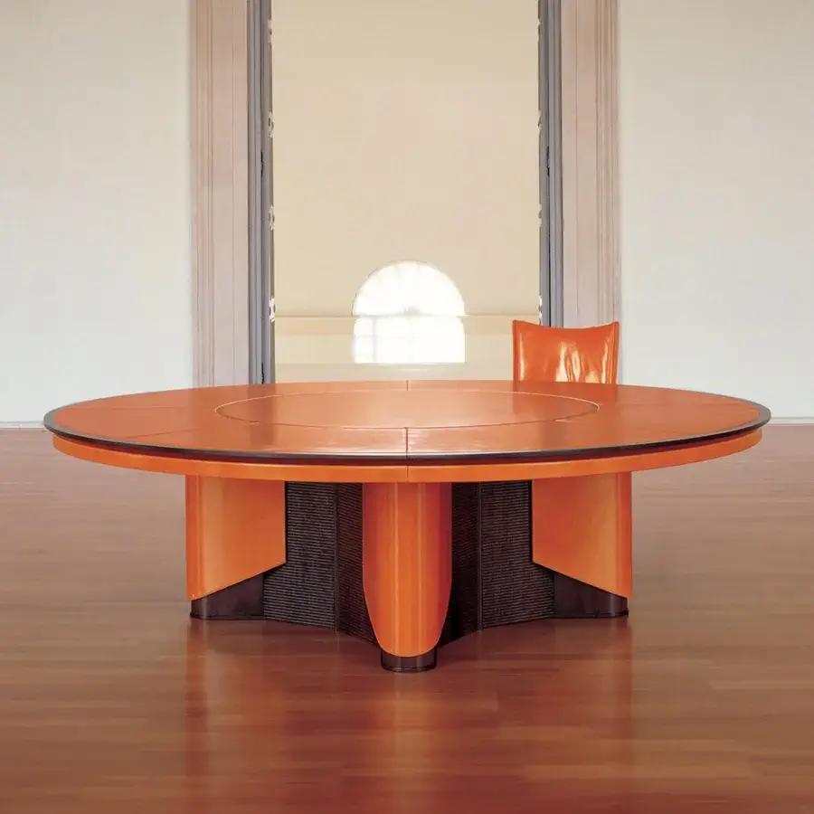 Superior Mascheroni Planet conference table with a segmented bright orange tabletop and glossy multi-faceted base built in Italy