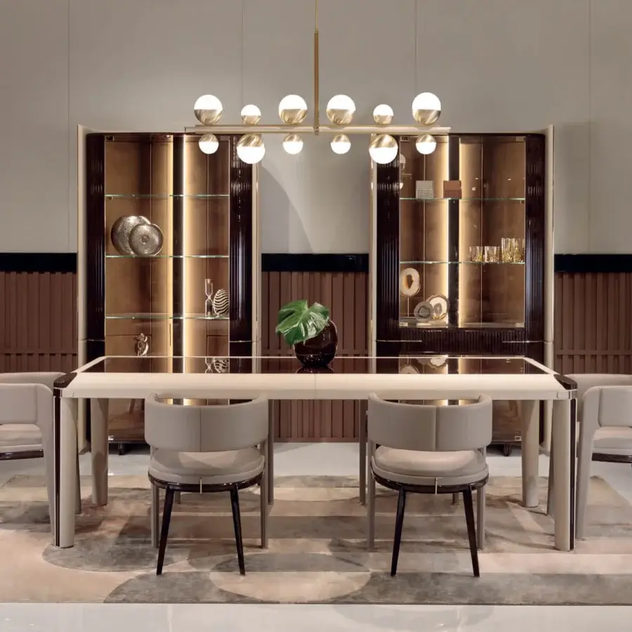 Distinguished Turri Eclipse table with light beige high-gloss top, rounded leather edges and grooved wooden legs built with gold metal details