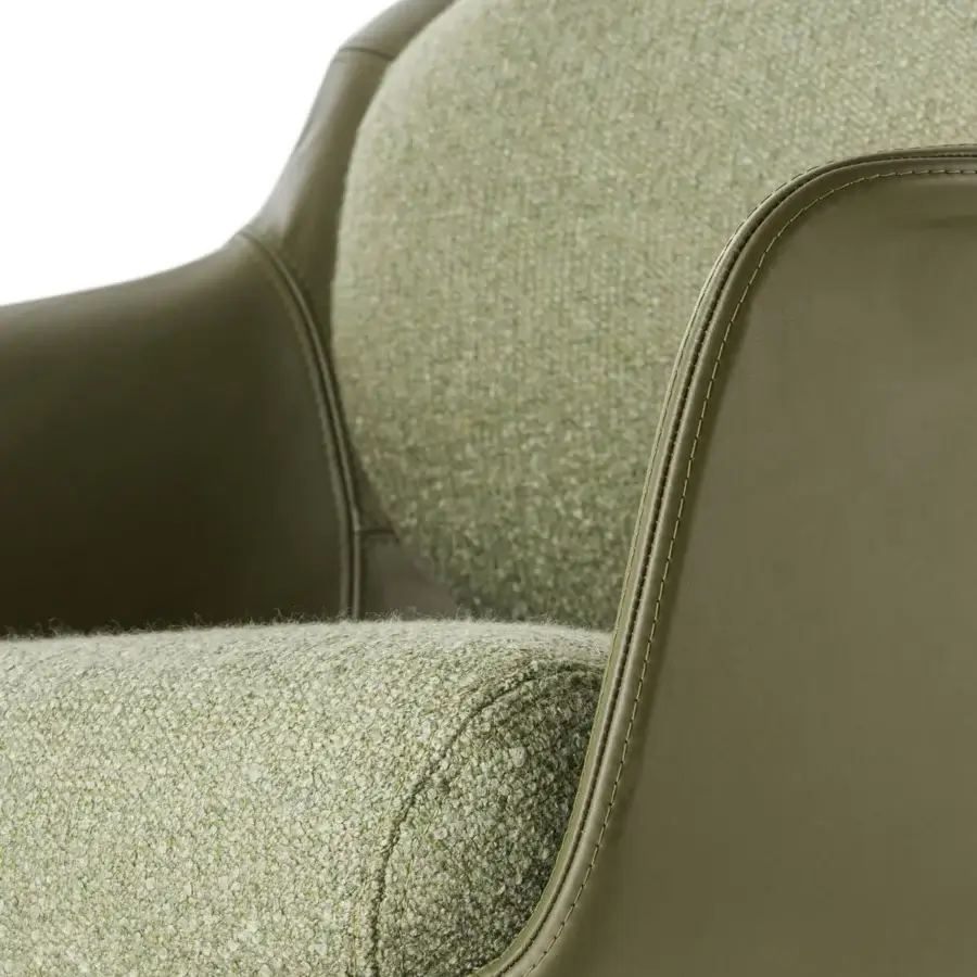 Superior Turri Echo armchair upholstered in light green textured textile with a matching green leather frame