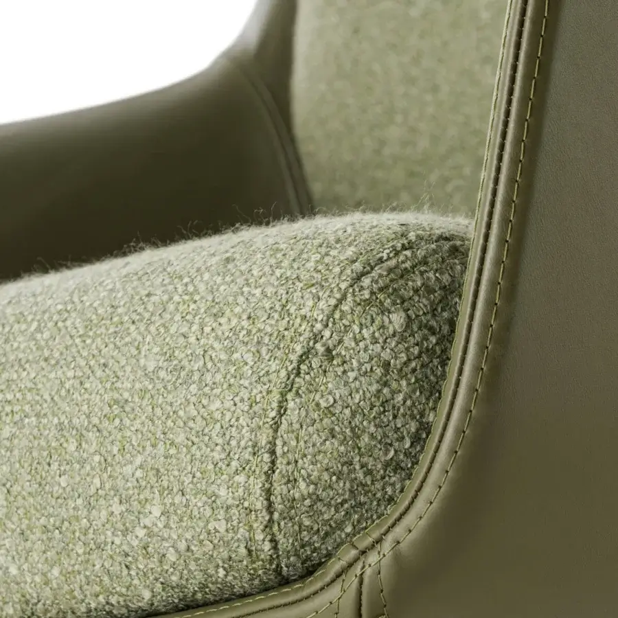 Remarkable Turri Echo armchair crafted in light green nubby textile with a smooth olive green leather frame and detailed stitching