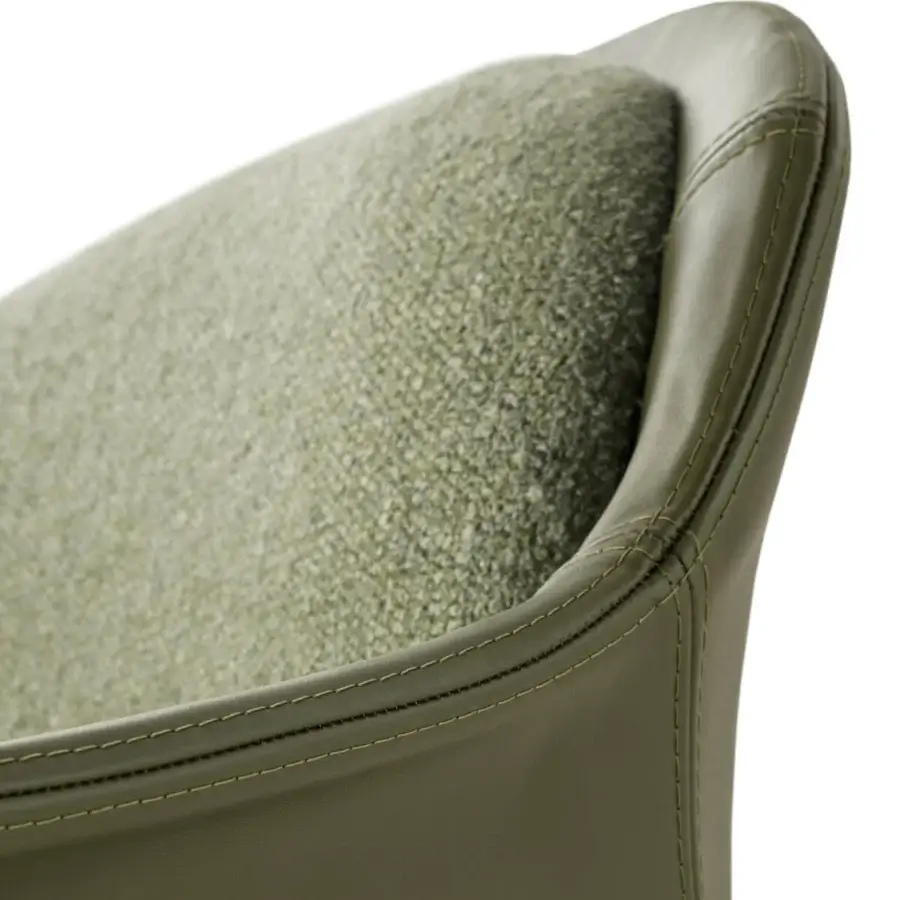 Elegant Turri Echo armchair combines comfort with a nubby sage green textile interior and smooth sage green leather shell crafted with light green stitching