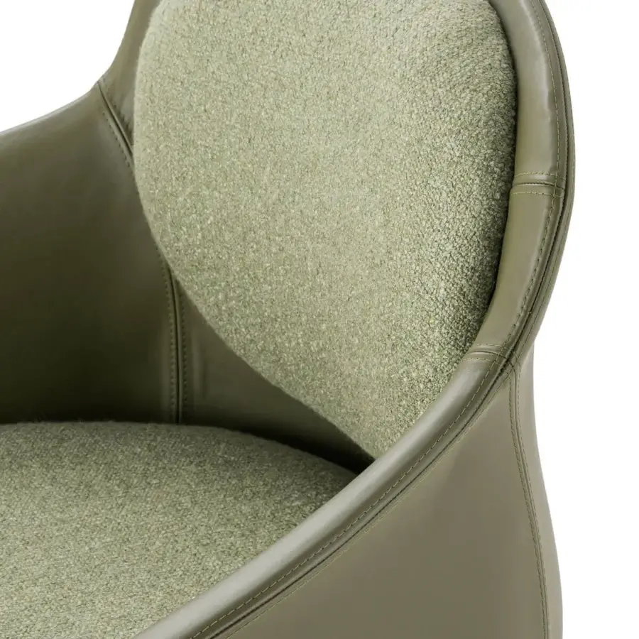 Distinguished Turri Echo armchair presents comfortable seating with muted green leather and a subtly textured textile upholstery