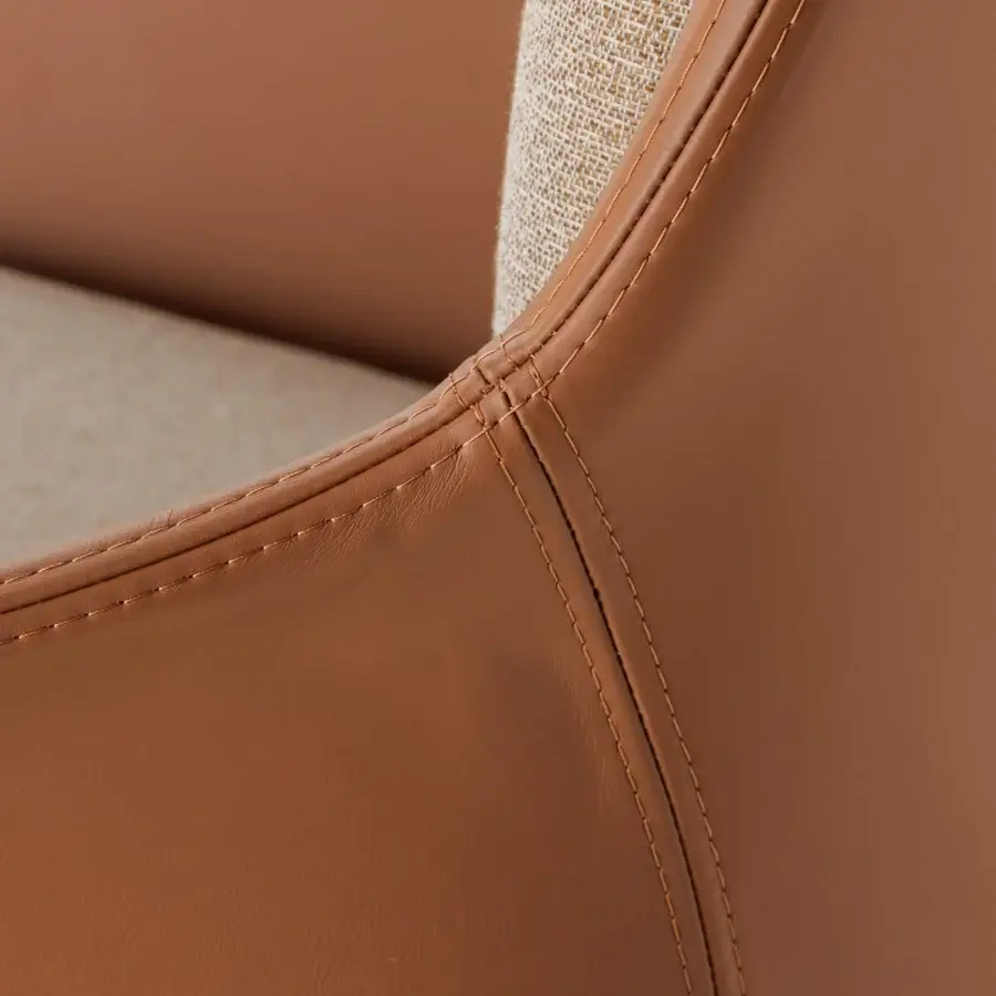 Distinguished Turri Echo armchair with supple light tan leather upholstery and lighter beige textile backing