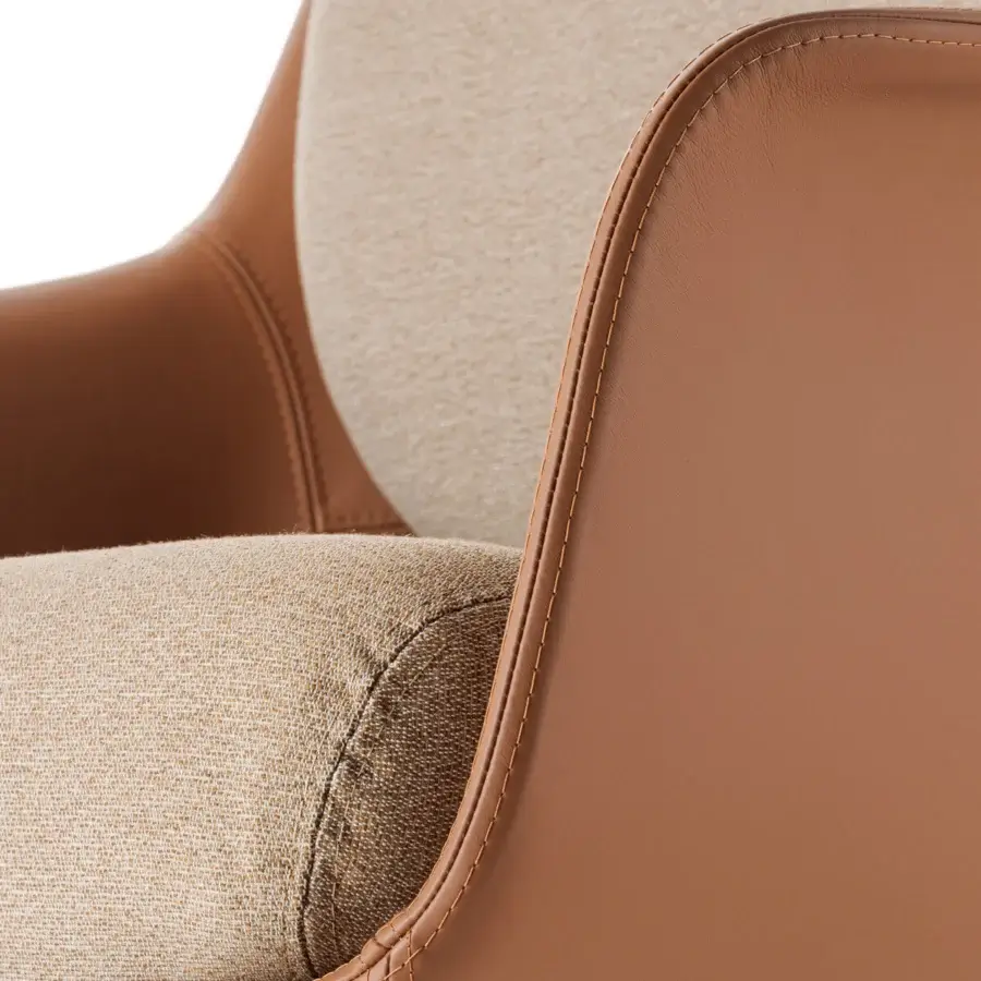 Superior Turri Echo armchair in beige textured textile and tan leather with smooth refined finish