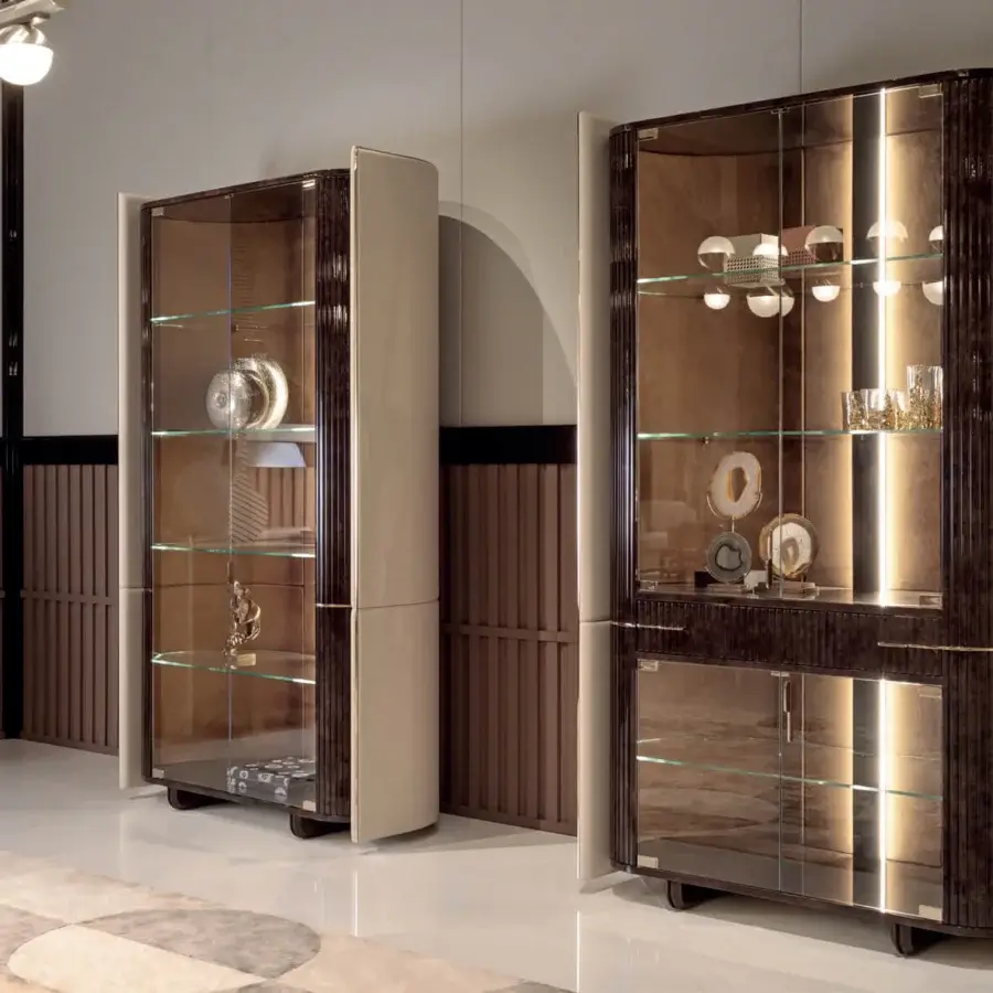 Superior Turri Eclipse showcase built with wood, cream leather panels, and glass doors with internal lighting and glossy finish