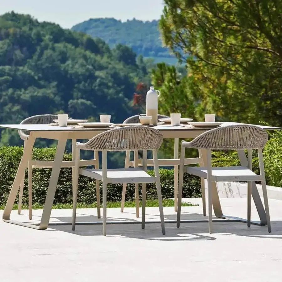 Elegant Varaschin Clever armchair with powder-coated aluminum and woven textilene offering a balanced matte finish