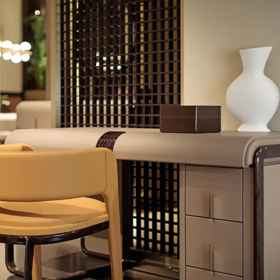 Elegant Turri Eclipse desk with a curved glossy lacquered wooden structure and gold metal drawer details