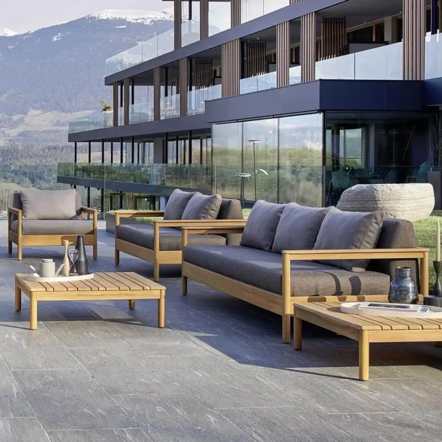 Exceptional Varaschin Bali lounge chair with light teak wood and gray upholstered cushions crafted with a smooth finish