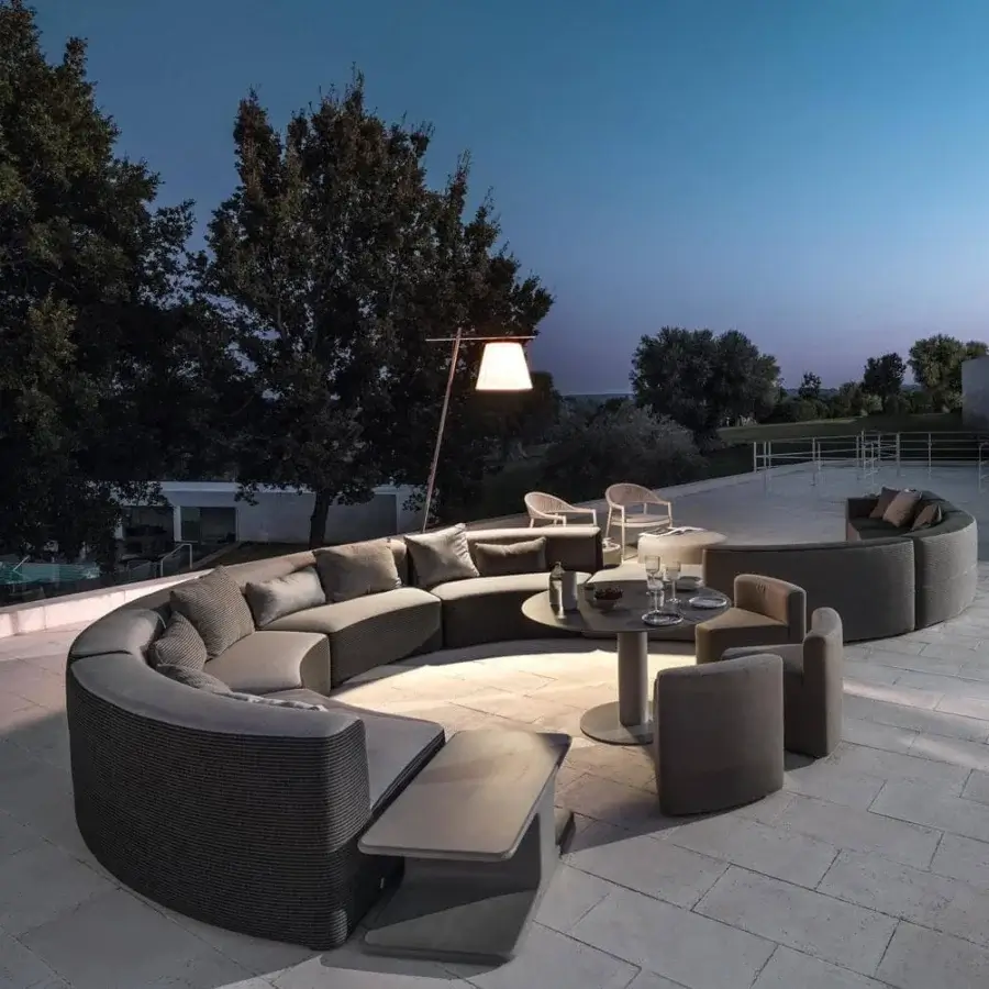 Elegant Varaschin In&out chair crafted in Italy with muted gray fabric and waterproof okoumè wood structure