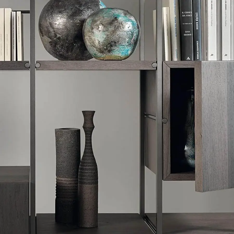 Elegant Acerbis Outline bookcase with dark grey or brown shelves and a slender dark metal framework