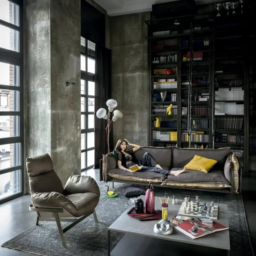Distinguished Arketipo Auto-Reverse sofa crafted in dark brown textured textile with gold trim and a contrasting yellow square cushion