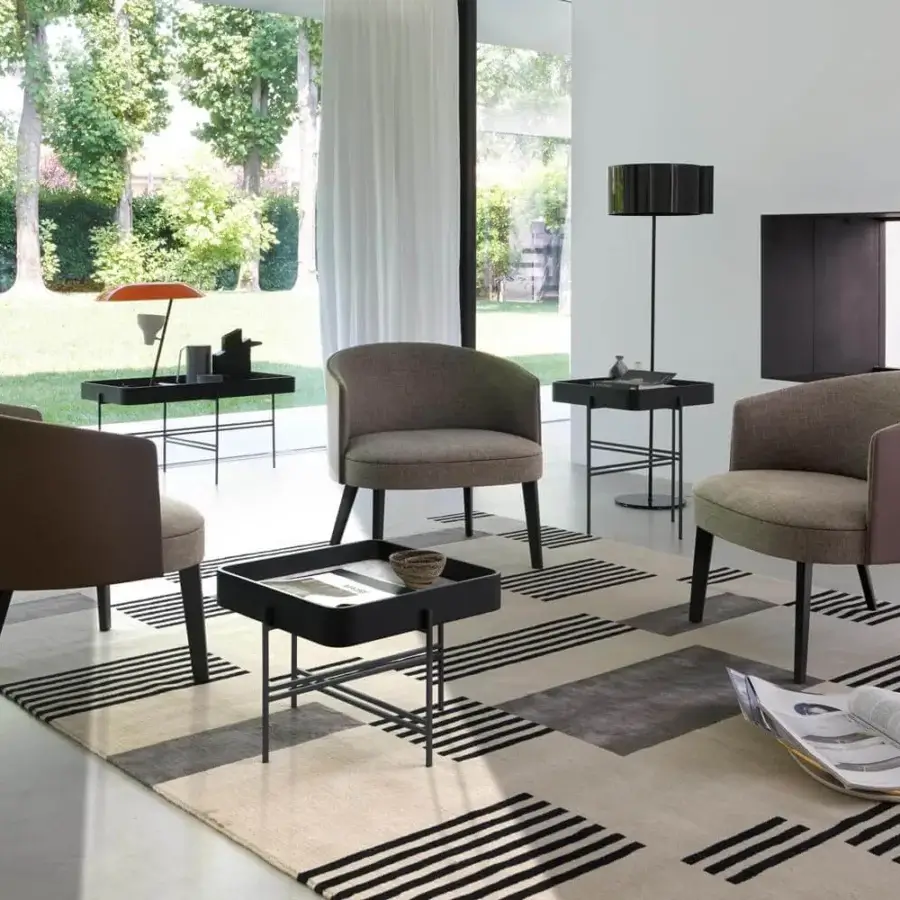 Elegant Potocco Lena lounge chair in muted brown-gray textile with solid ash legs and dark matte finish