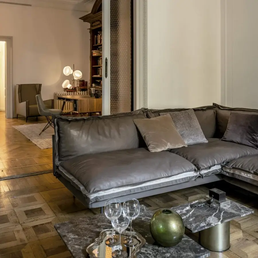 Superior Arketipo Auto-Reverse sectional with warm brown textile or leather upholstery and minimal metal base