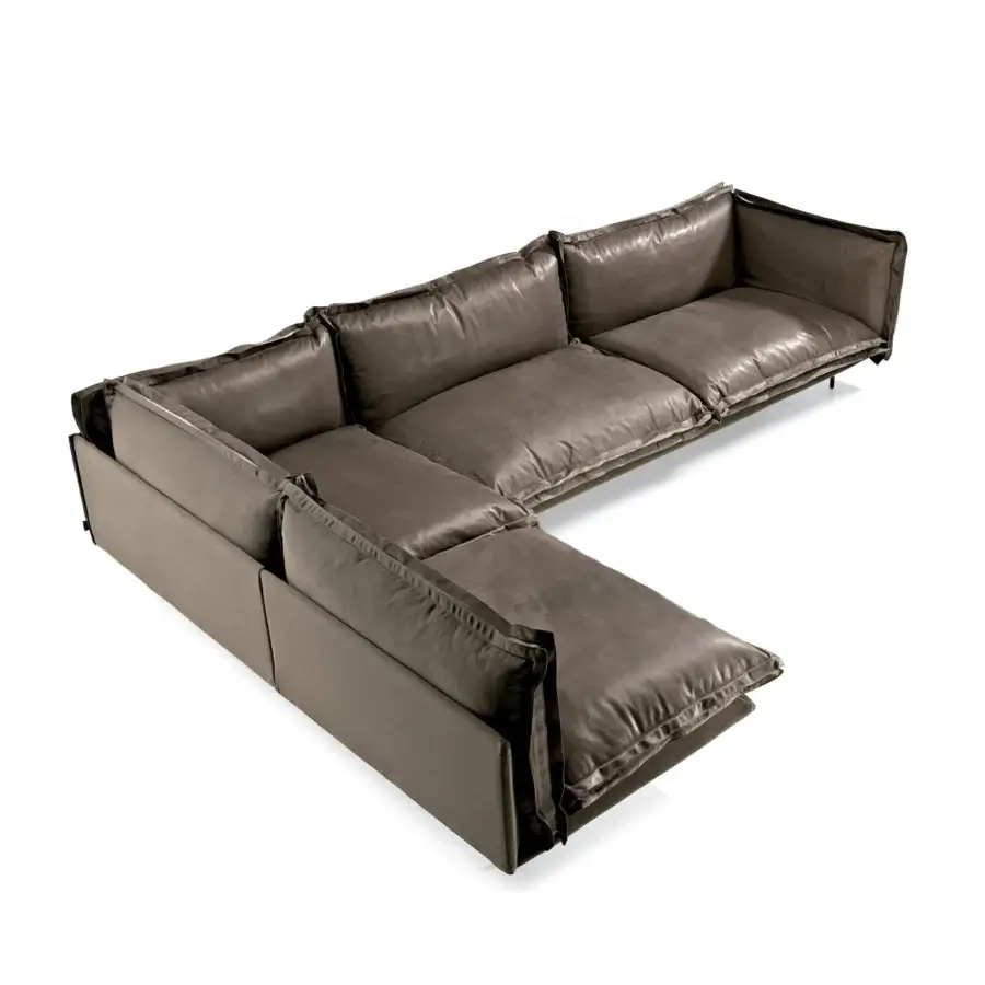 Distinctive Arketipo Auto-Reverse sectional crafted with brown-gray leather-like material and a matte sheen, exhibiting flounces and prominent zippers