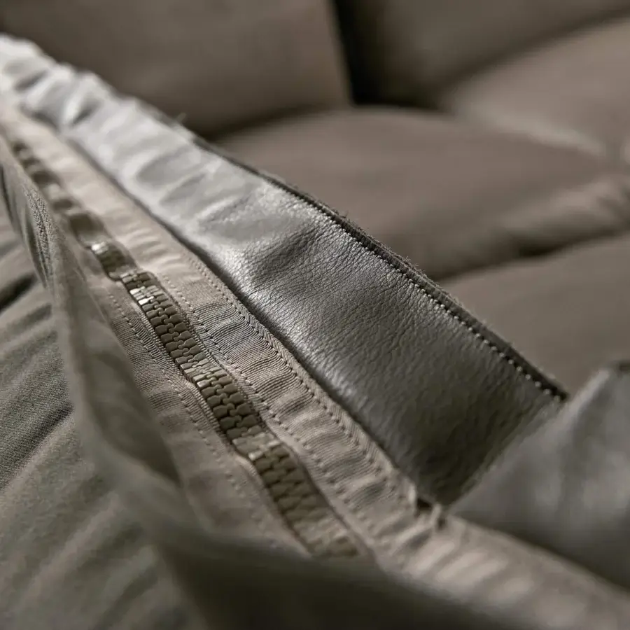 Elegant Arketipo Auto-Reverse sectional with a two-sided cover built in neutral textile and matte leather detailing