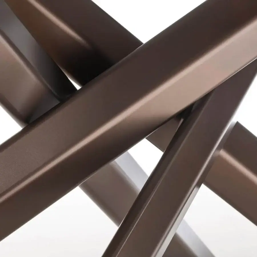 Distinguished Varaschin System Star table with bronze extruded aluminum legs and innovative rhomboidal intersecting metal design