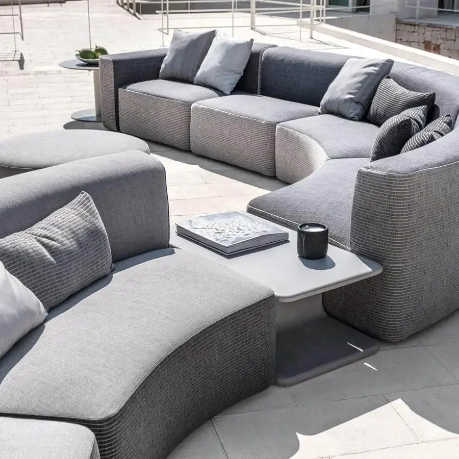 Elegant Varaschin Belt sectional with curved silhouette, varying shades of gray and bi-fabric construction crafted in Italy with okumé wood
