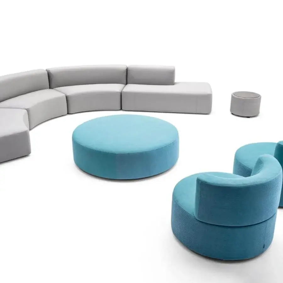 Elegant Varaschin Belt lounge chair with rounded shape and okumè wood structure in uniform blue upholstery