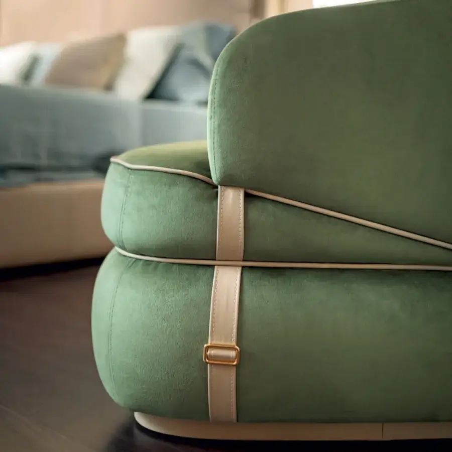 Captivating Turri Bloom lounge chair with graceful lines upholstered in muted olive green velvety textile and golden buckles