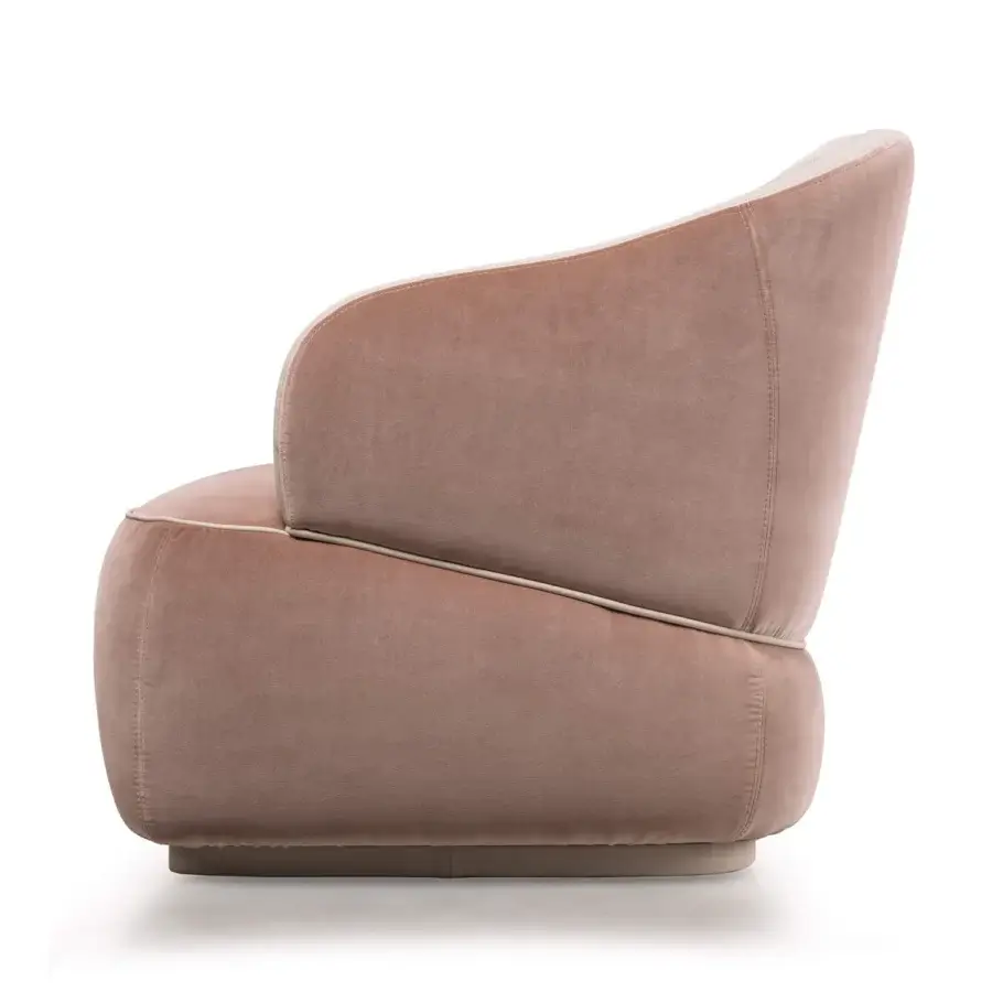 Captivating Turri Bloom lounge chair with soft lines upholstered in plush muted rose textile and light beige trim