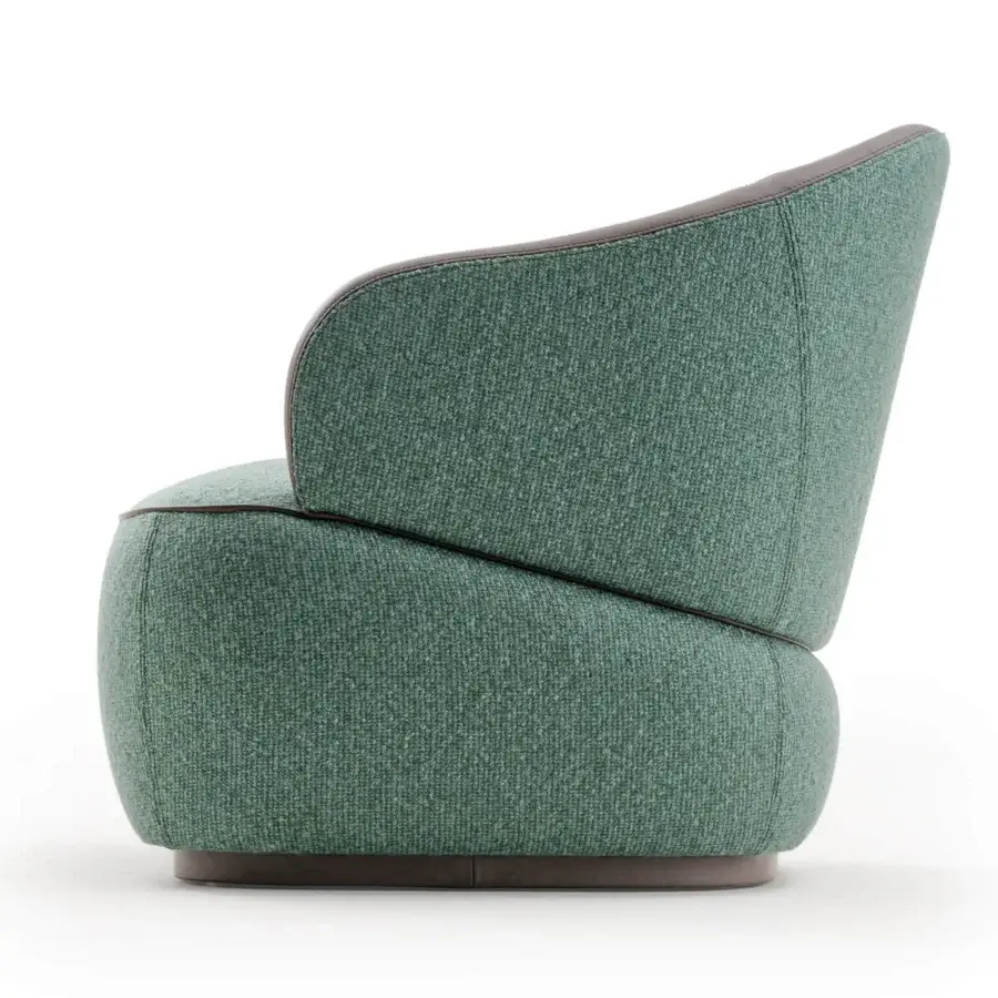 Distinguished Turri Bloom lounge chair with graceful lines upholstered in textured green woven fabric and dark brown leather trim