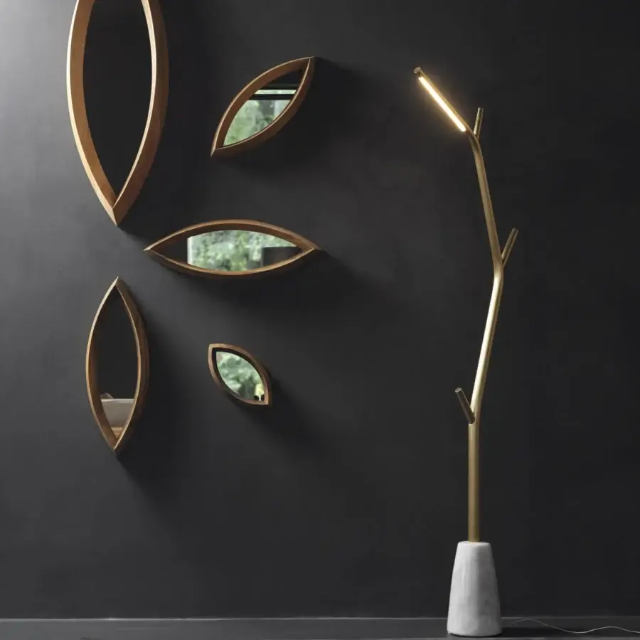 Distinguished Horm Aira floor lamp with organic silhouette crafted in golden brass and conical marble base with matte finish