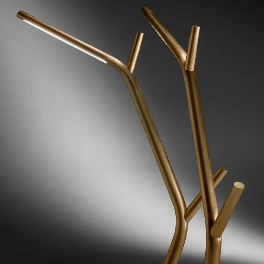 Distinguished Horm Aira floor lamp with organic silhouette, golden brass frame and premium marble base crafted in Italy