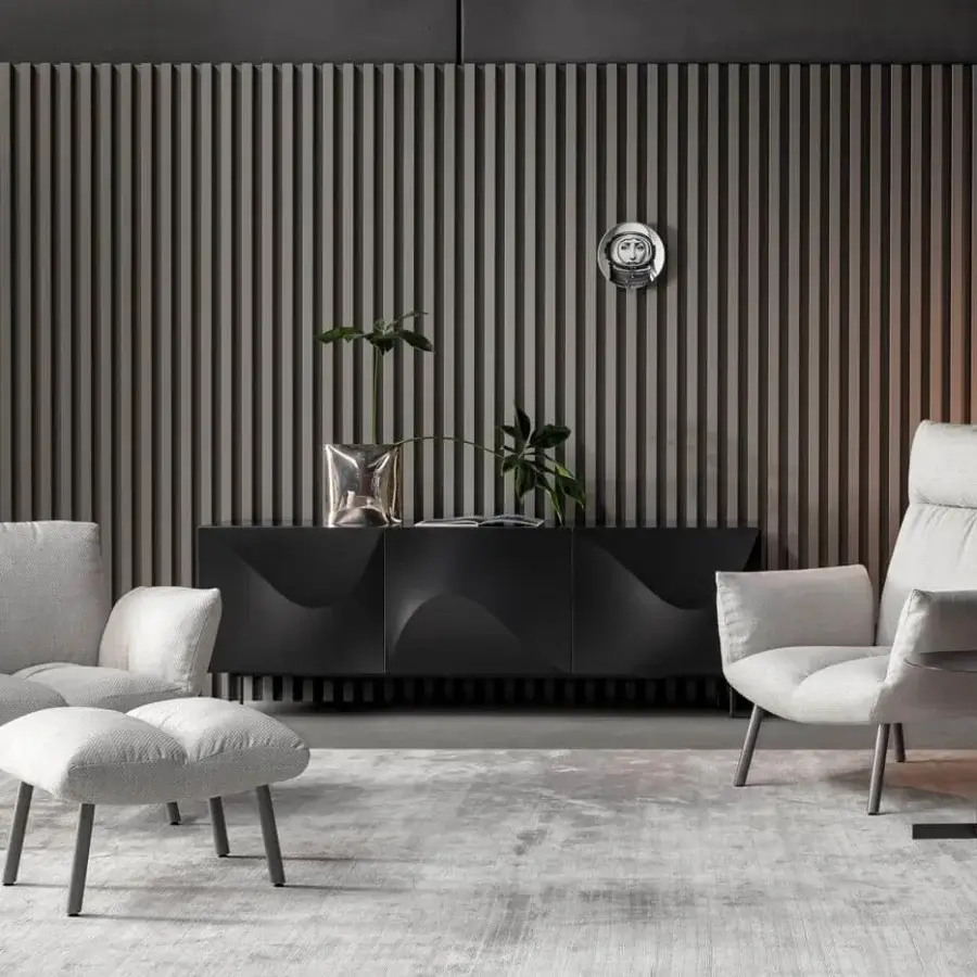 Distinguished Bonaldo Pil lounge chair with enveloping form upholstered in light gray textile and slender gray metal legs