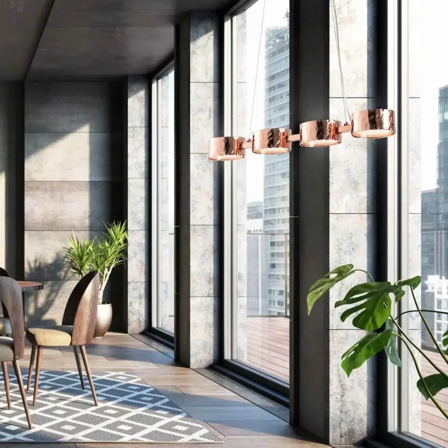 Elegant Stillux Circle suspension lamp with four circular matt white glass diffusers encased in hammered copper-toned metalwork