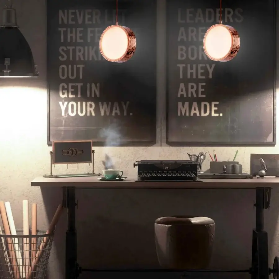 Elegant Stillux Circle suspension lamp with a circular matt white glass diffuser and hammered metal frame in copper tone