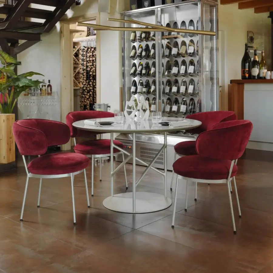 Exceptional Horm Alexander table with light marble tabletop and slender metal legs crafted in Italy