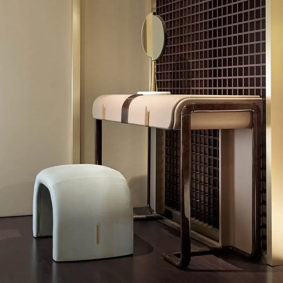 Superior Turri Eclipse vanity with curved silhouette, light beige leather and glossy lacquered wood with light gold metal accents
