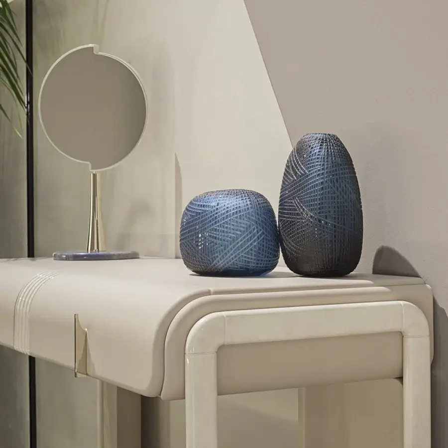 Distinguished Turri Eclipse vanity with rounded volumes, light beige leather and glossy lacquered wooden structural elements with light gold metal accents