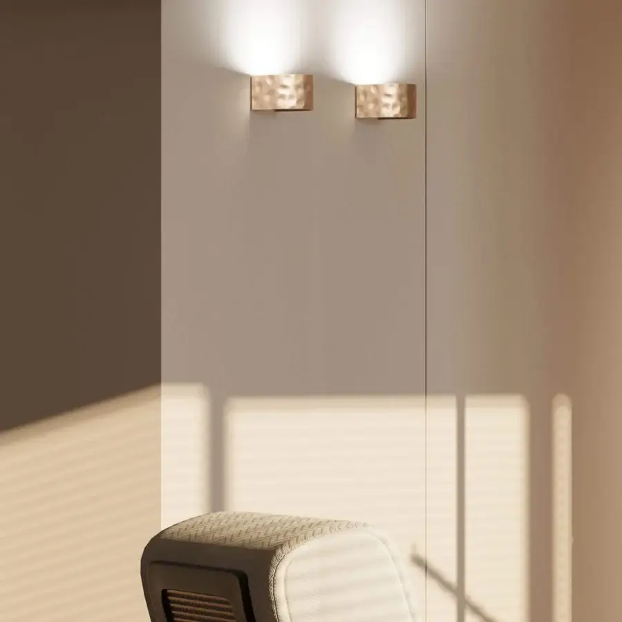 Exceptional Stillux Shape wall lamp with a refined hammered metal frame and bronze or brass toned finish casting diffused light upwards