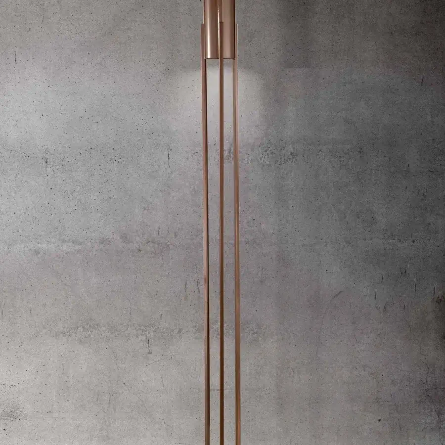 Innovative Stillux The Shape floor lamp presents a cylindrical silhouette with a glossy copper metal structure and slender rod support