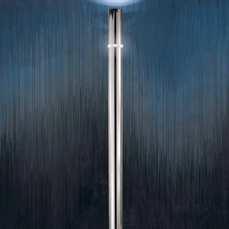 Distinguished Stillux Shape floor lamp presents a cylindrical metal structure with a bright silver finish and clear crystal lighting ring