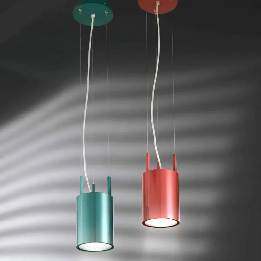 Exceptional Stillux Shape suspension lamp with a cylindrical metal structure and frosted white glass diffuser in a glossy coral finish