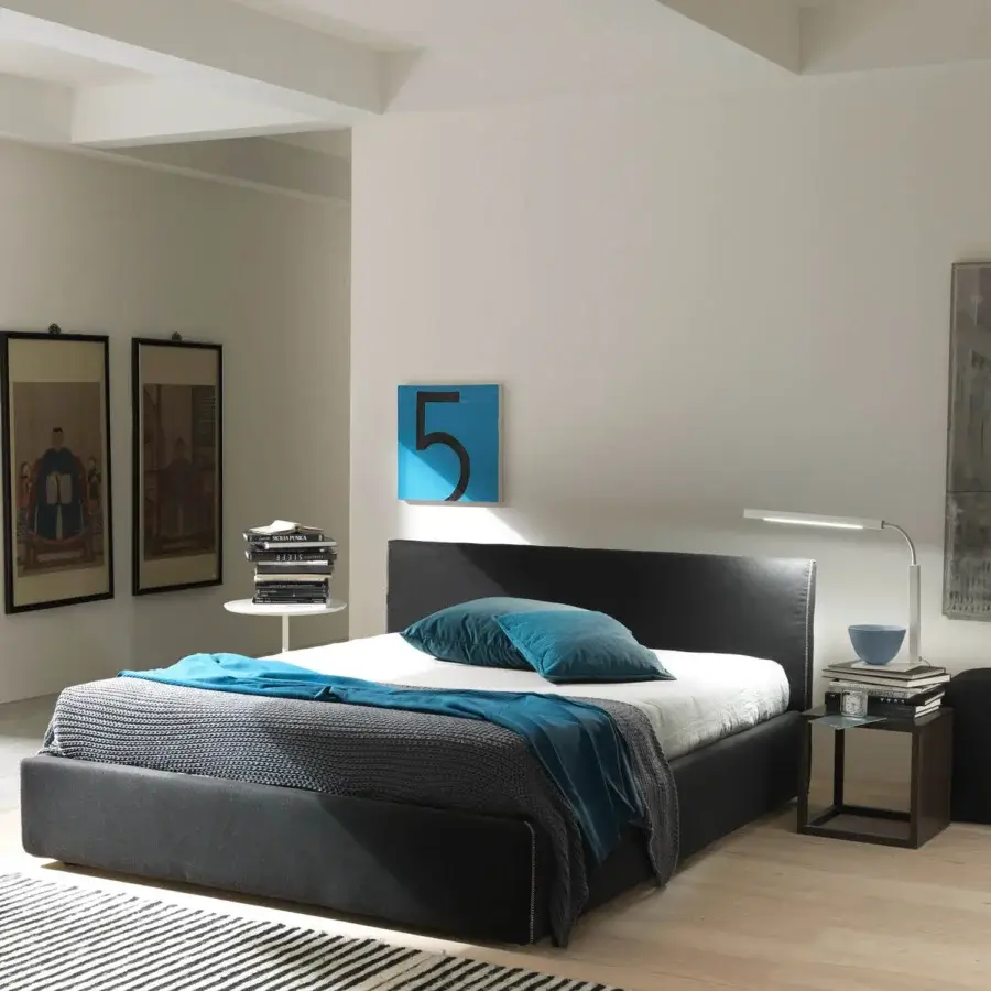 Elegant Bolzan Letti bed upholstered in dark gray textile with a firwood structure and removable cover
