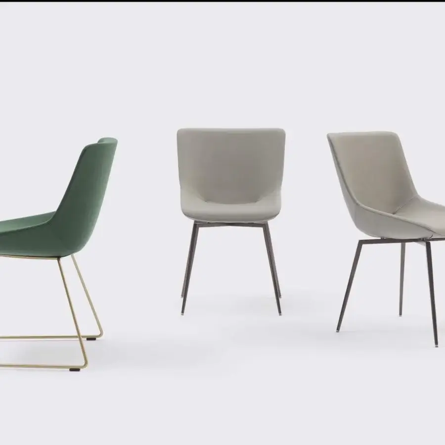 Distinguished Bonaldo Artika chair with sinuous padding, metal base and matte green textile upholstery crafted with an expansive backrest