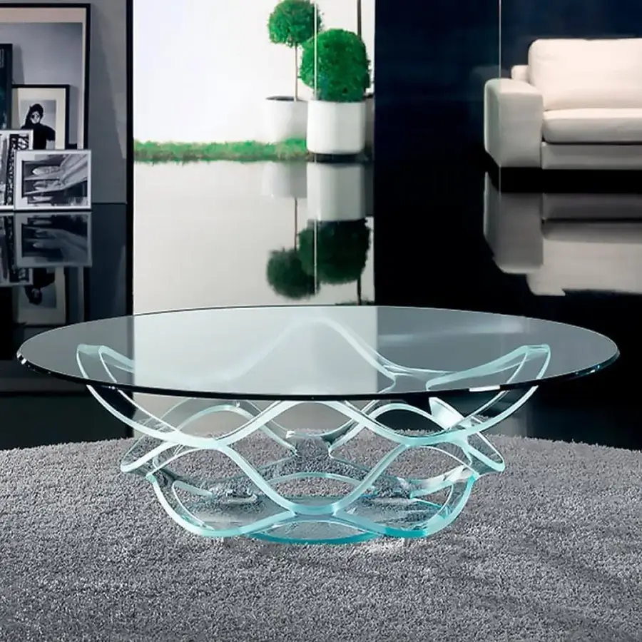 Exceptional Reflex Neolitico coffee table with clear glass tabletop and subtly interwoven forged iron base in gold leaf finish