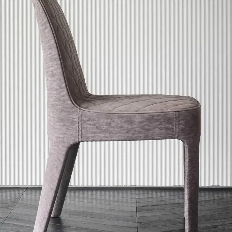Lavish Rugiano Aria chair upholstered in mauve quilted textile with polished lacquer legs