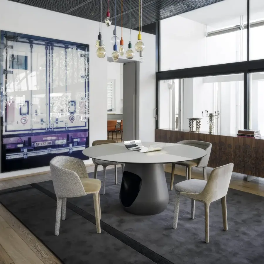 Distinctive Horm Barbara table with a light gray wood top and matte dark gray sculptural concrete base