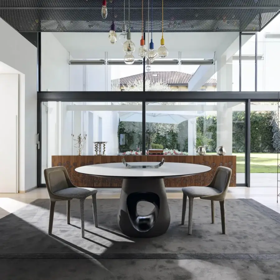 Exceptional Horm Barbara table with a sculpted concrete base and premium marble tabletop in matte finish
