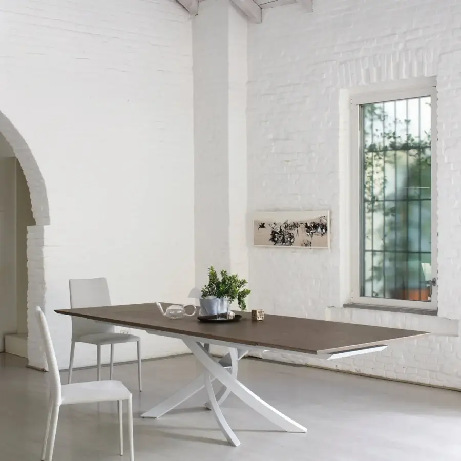 Elegant Bontempi Artistico table with dark brown wood top and curved white metal base crafted using old forging techniques