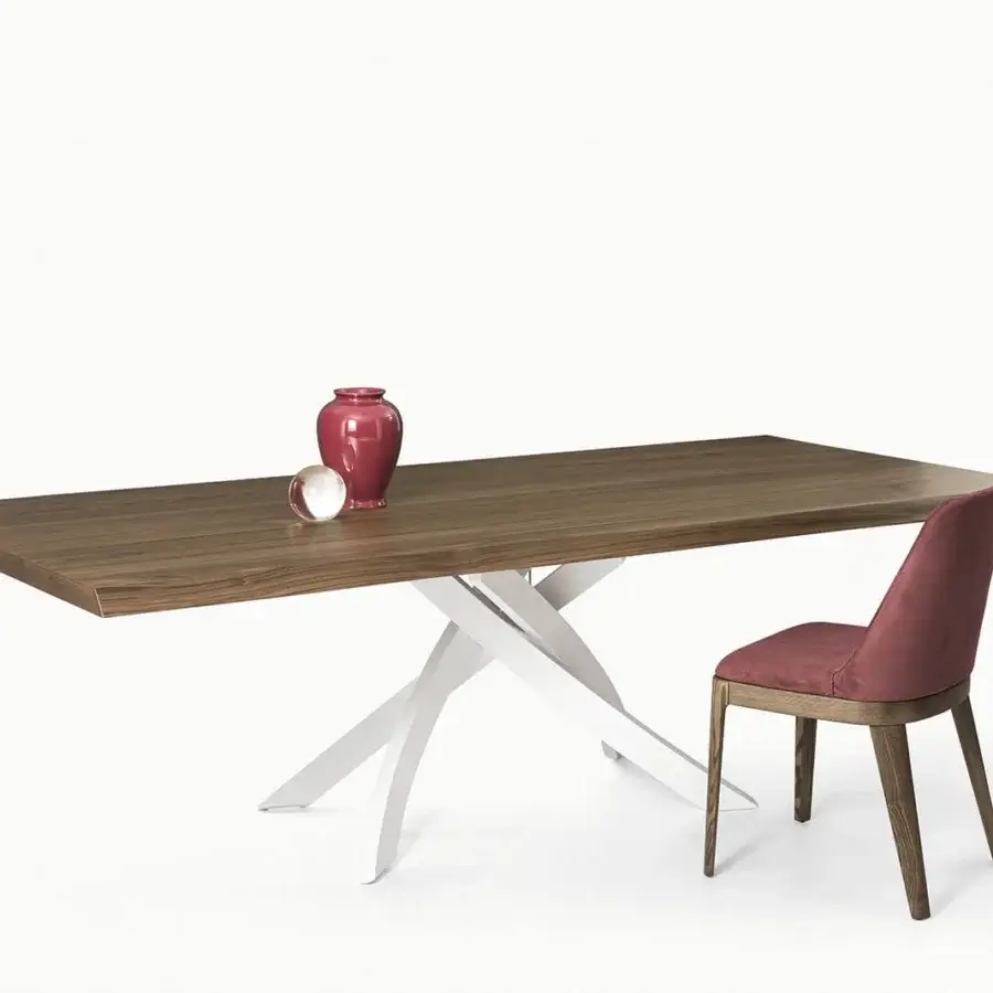 Distinguished Bontempi Artistico table with brown wood top and crossing white supports paired with a chair in muted red upholstery and wood legs